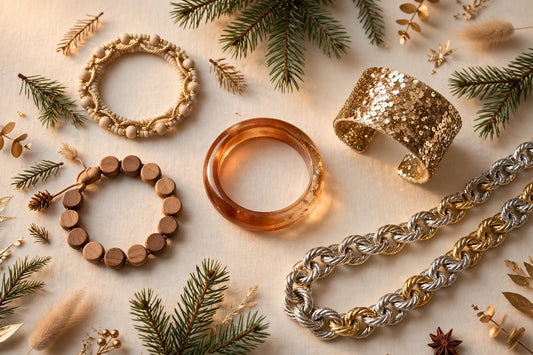 Sparkling Christmas jewelry gifts flat-lay on a warm cream background