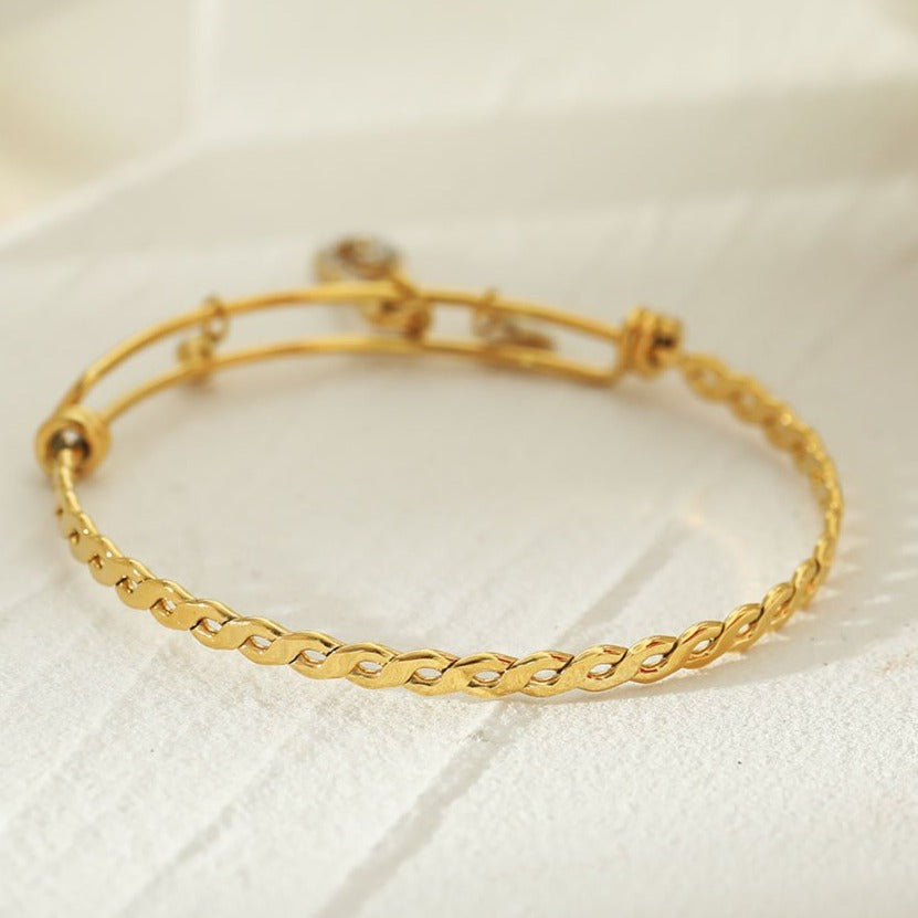 CHRISTINA: Charms Adorned Gold Bracelet