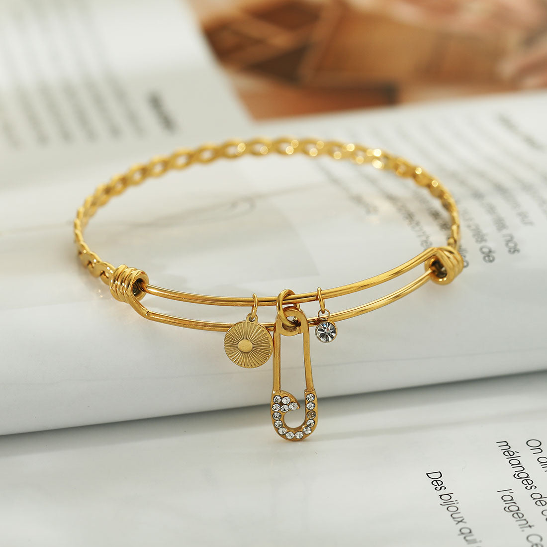 CHRISTINA: Charms Adorned Gold Bracelet