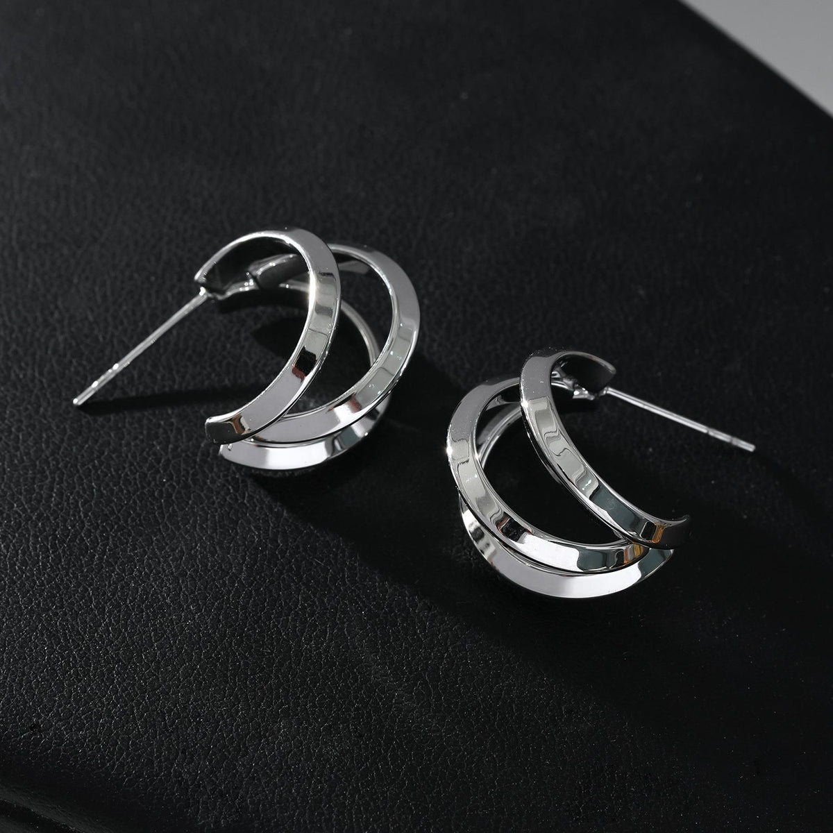 GRIZZANA: Triple Banded Hoop Earrings in Silver