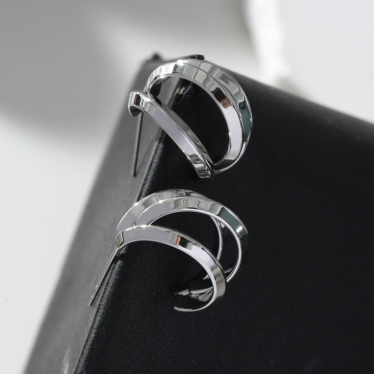 GRIZZANA: Triple Banded Hoop Earrings in Silver