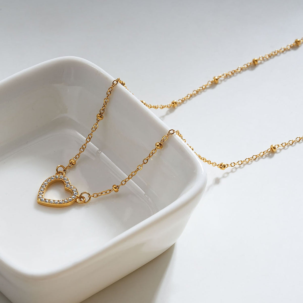 Style CHERISH Gold: Beaded Chain Anchoring an Elegant Pavé Heart Charm Pendant