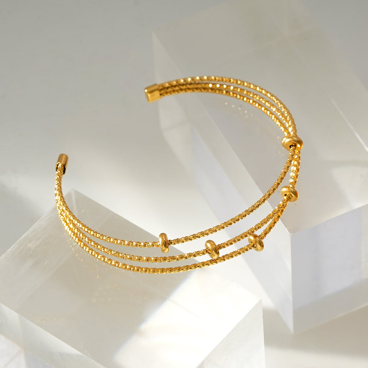 Style FARZIKA Gold: Triple Stacked Textured Beaded Bracelet