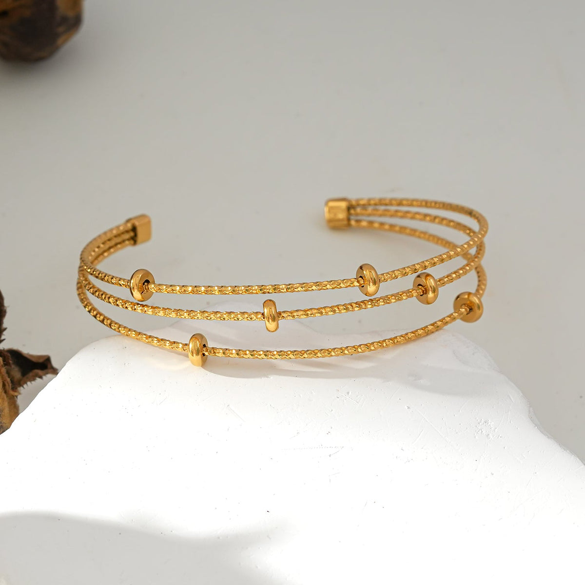 Style FARZIKA Gold: Triple Stacked Textured Beaded Bracelet