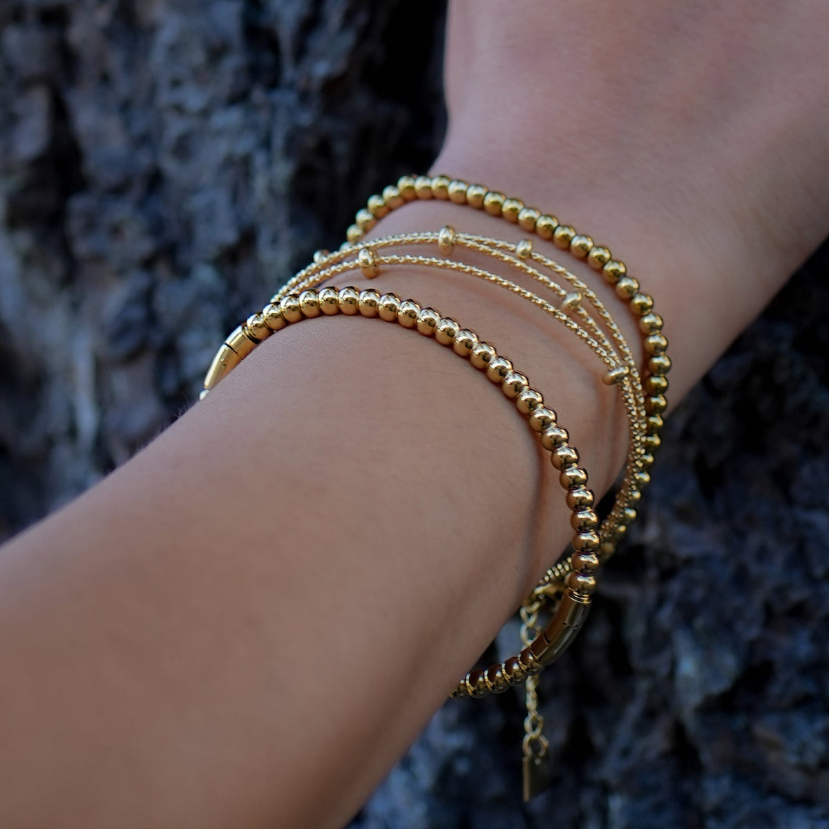 Style FARZIKA Gold: Triple Stacked Textured Beaded Bracelet