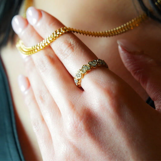 JEZREEL: Heart-Shaped Mini Charms Encircled Ring With Zirconia Crystal Centre Pieces