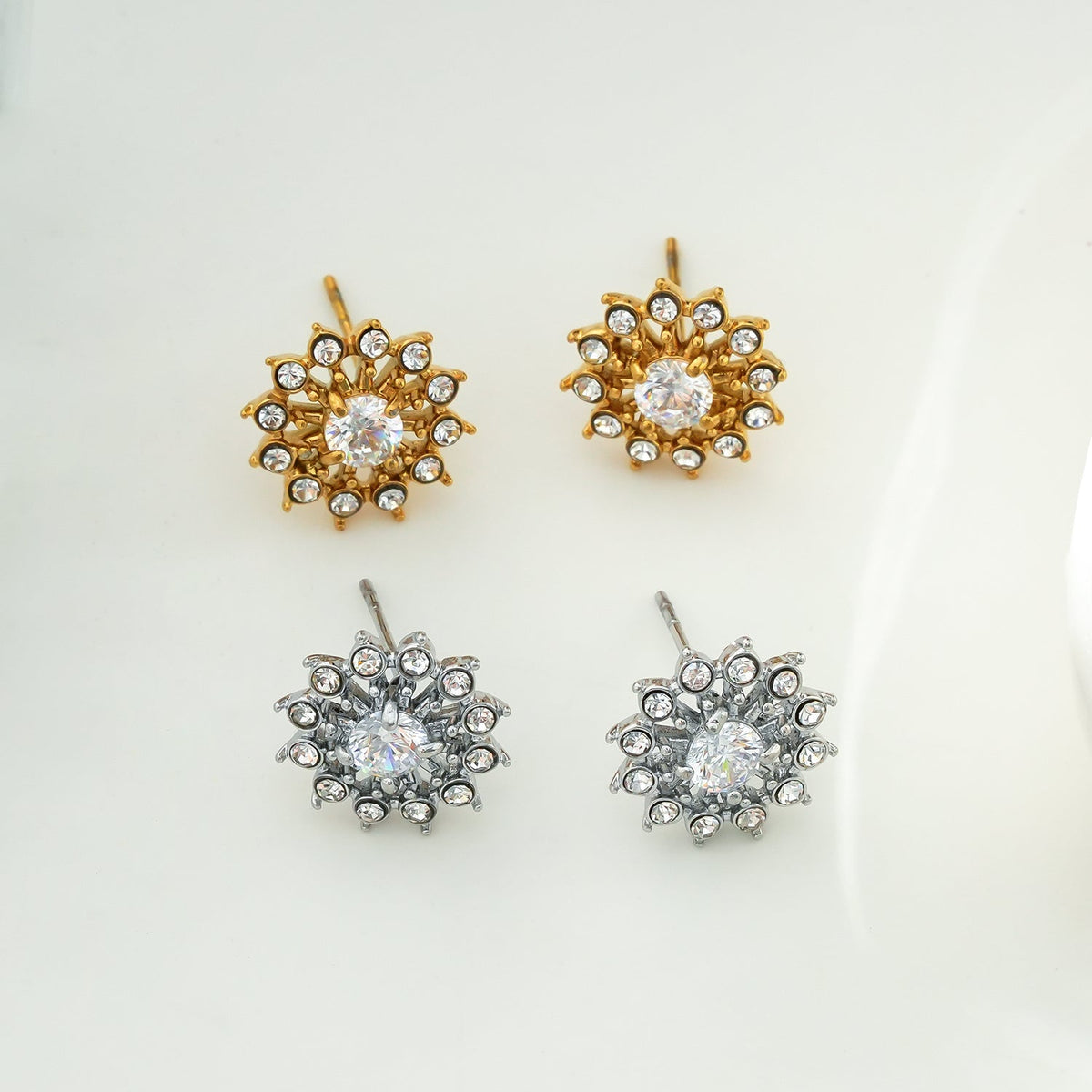 KERELA White Gold (Silver Toned): Shimmering Star Zirconia Stud Earrings