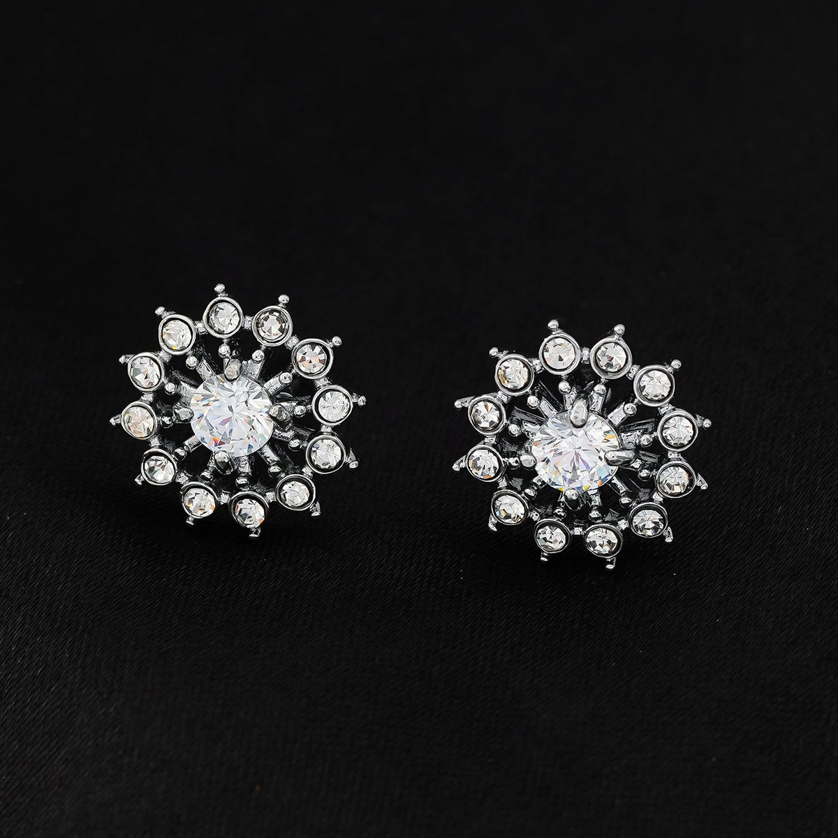 KERELA White Gold (Silver Toned): Shimmering Star Zirconia Stud Earrings