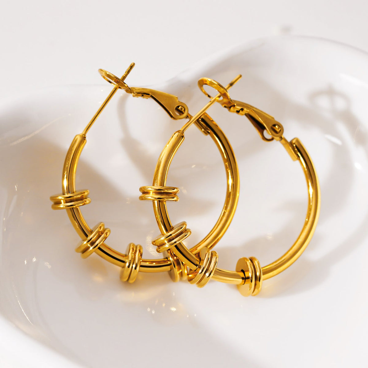 MINATO: Modernist Hoop Earrings Anchoring Industrial-Chic Double Discs.