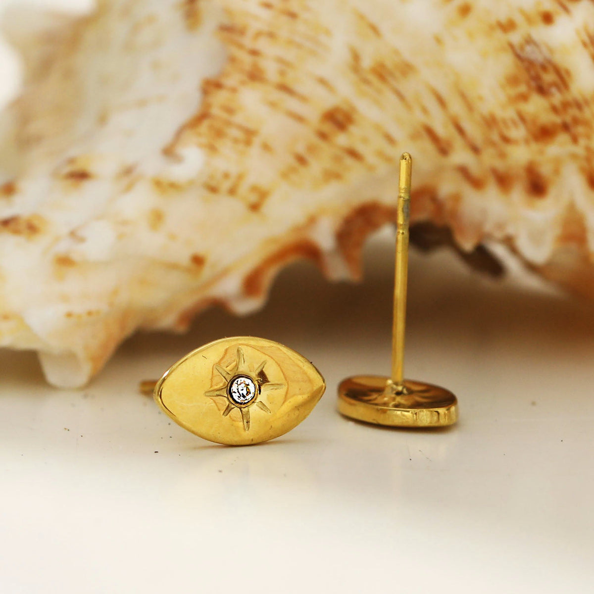 TINDRA: Oval Shaped Gold Stud Earrings Featuring a Solitaire Zirconia