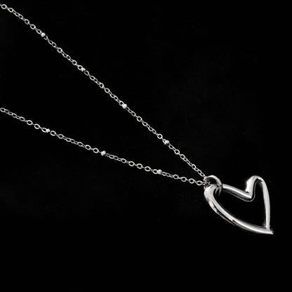 SMITTEN Silver (White Gold): Dainty Beaded Chain Anchoring an Abstract Heart Shaped Pendant