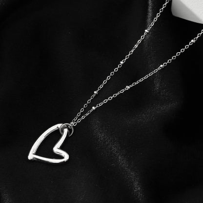 SMITTEN Silver (White Gold): Dainty Beaded Chain Anchoring an Abstract Heart Shaped Pendant
