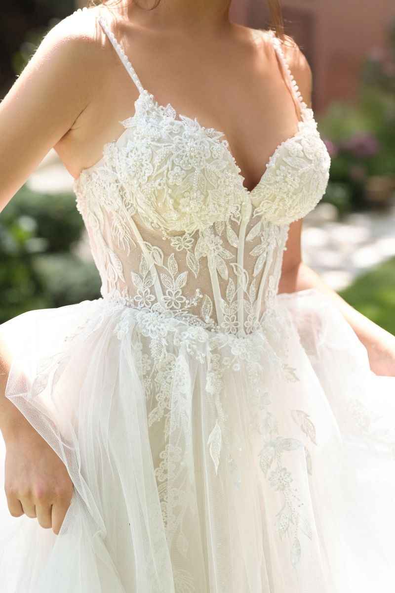 Deep neckline, beaded spaghetti straps & illusion lace corset bodice